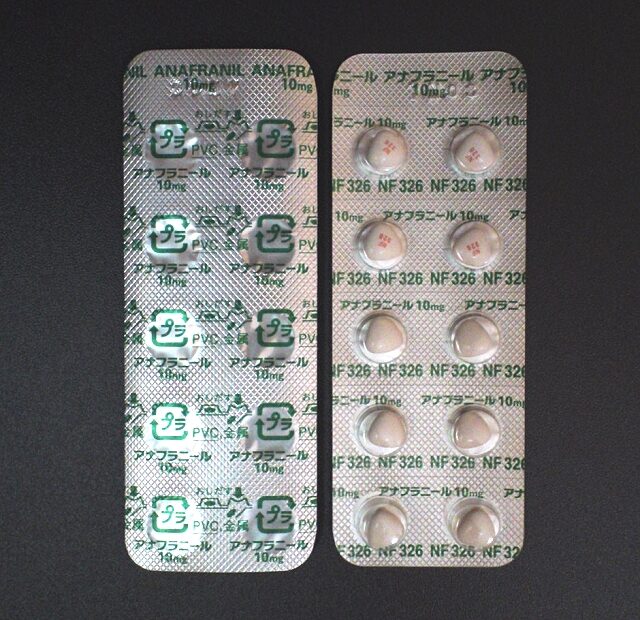 Two blister packs of Anafranil-brand clomipramine 10 mg tablets, shown front and back.