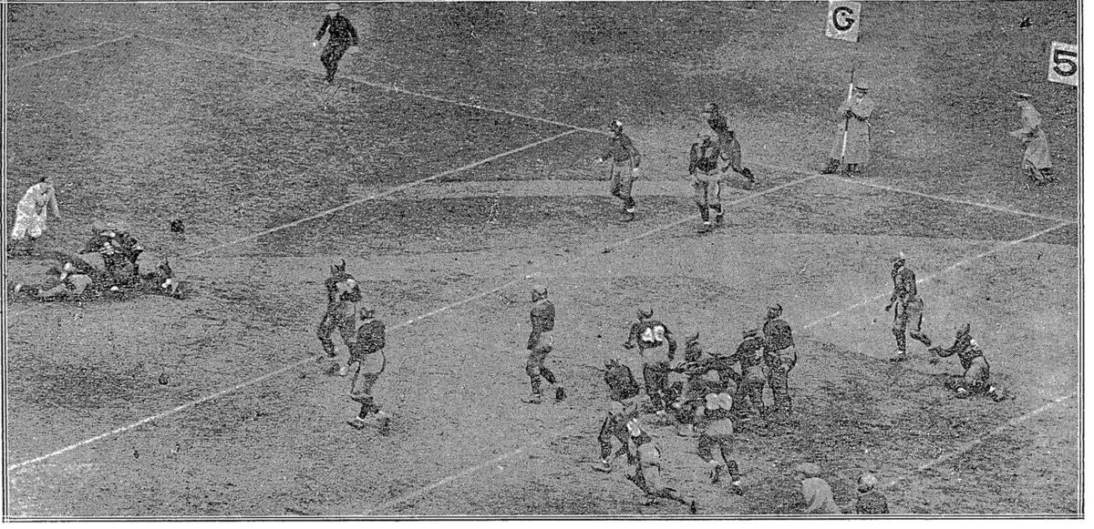 A black-and-white press photograph of the 1925 Army-Navy football game, a play at the goal line before a packed stadium crowd.