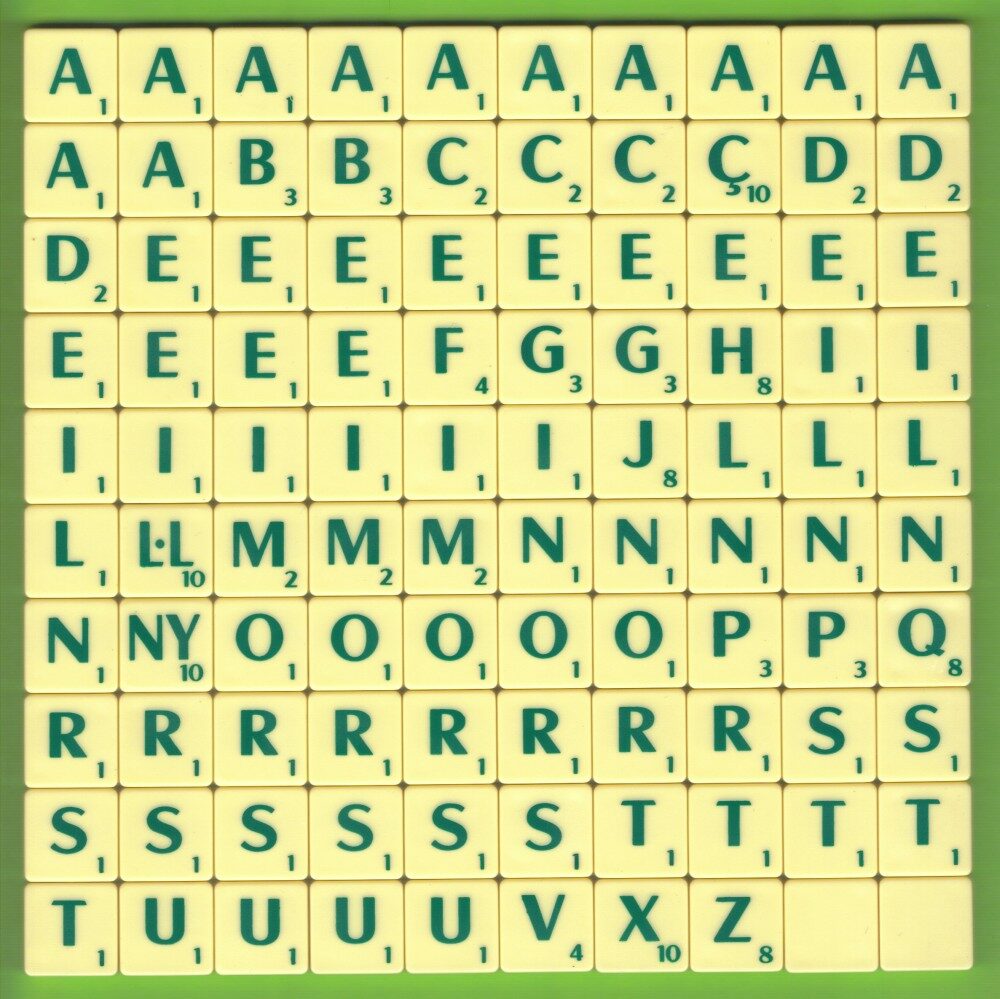 A full set of one hundred Catalan Scrabble letter tiles laid out in a grid, including single tiles for C-cedilla, L-middle-dot-L and NY, each marked ten points.