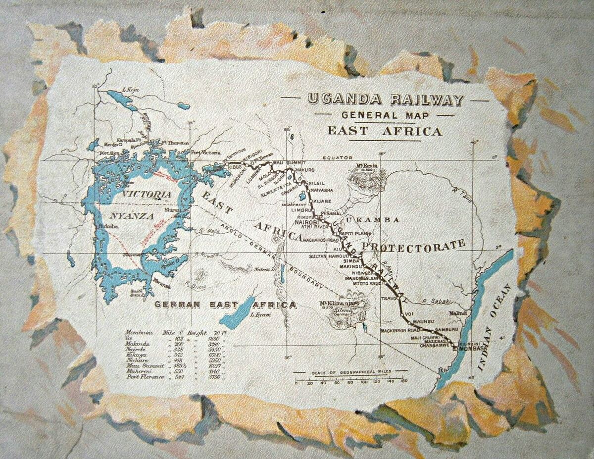 A printed and hand-tinted early twentieth-century map titled Uganda Railway, General Map, East Africa, showing the railway running inland from Mombasa on the Indian Ocean through Nairobi to Port Florence on Victoria Nyanza, with the Anglo-German boundary, German East Africa and a table of station mileages and heights.