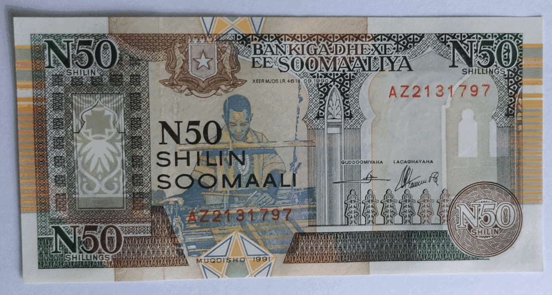Photograph of a fifty-shilling Somali banknote, with the denomination N50 in Somali and English and an engraved vignette of a seated man.
